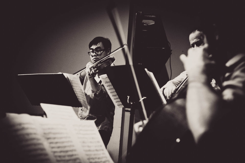 Violinist Fung Chern Hwei playing with other members of the Sirus Quartet.