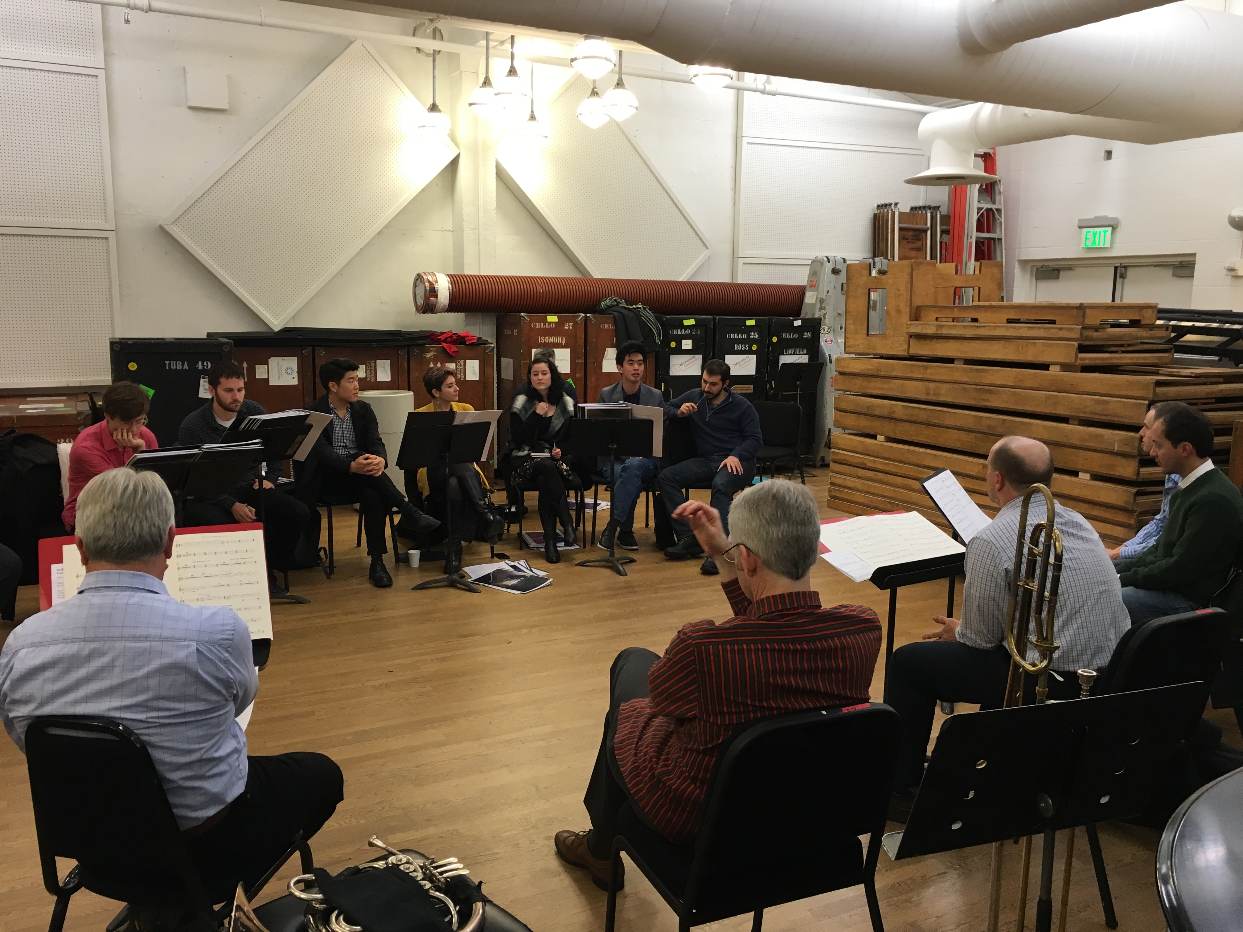 Daniel Schlosberg, Charles Peck, Peter Shin, Nina C. Young, Hilary Purrington, Andrew Hsu, and Saad Haddad talk through details in their pieces at a session with Minnesota Orchestra musicians during the Minnesota Orchestra Composer Institute.